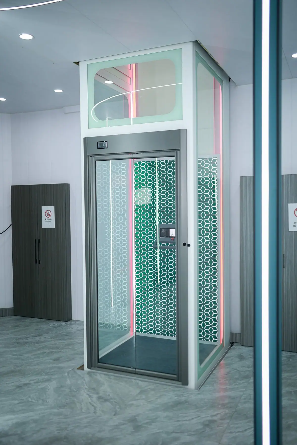 Levitex Pro glass home lift with a white frame and decorative LED lighting.
